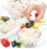 Hand puts berry in ice cream