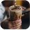 Hand holding glass of ice cream
